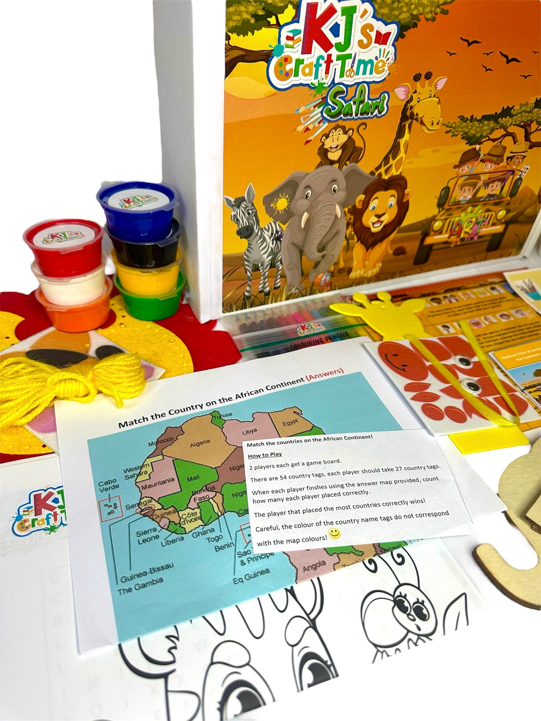 Close-up of Safari Craft Box materials, featuring paints, activity sheets, pencils, and African wildlife matching game.