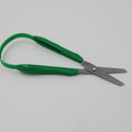 Green left-handed Easi-Grip Scissors lying open.