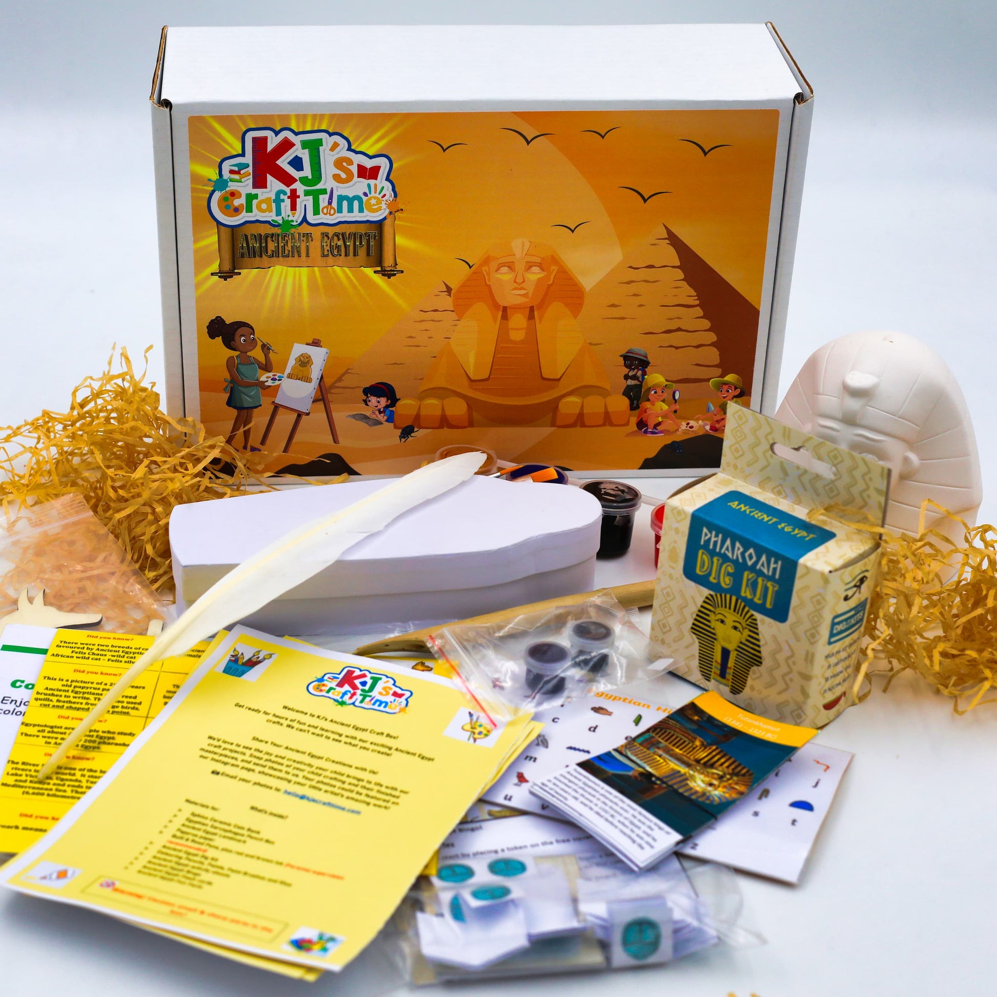Ancient Egypt craft kit contents including pharaoh dig kit, sarcophagus pencil box, sphinx coin box paints and educational activity sheets. 