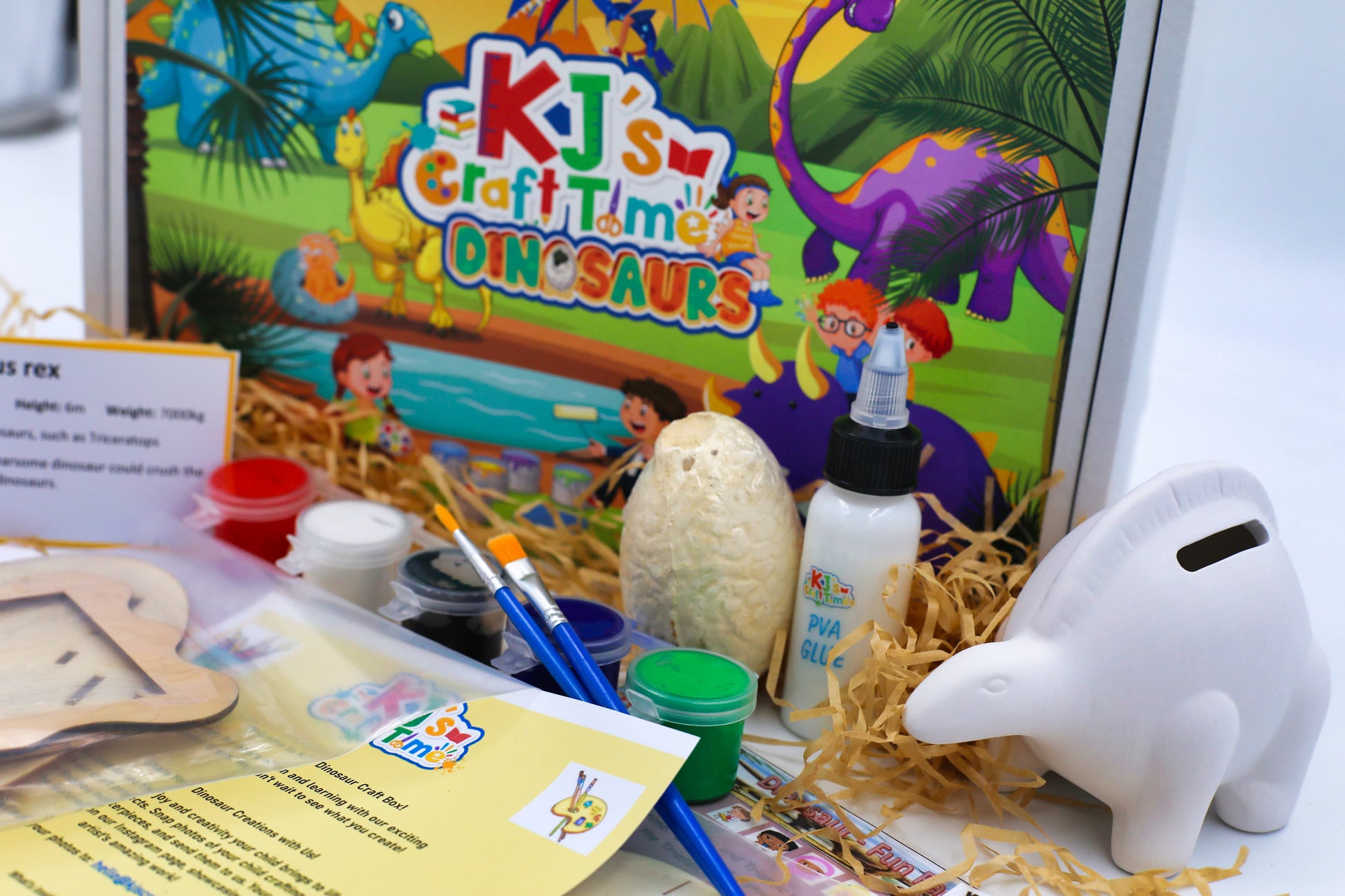 Educational dinosaur craft kit for kids that includes a dig kit and ceramic coin bank, designed for screen-free creative play.