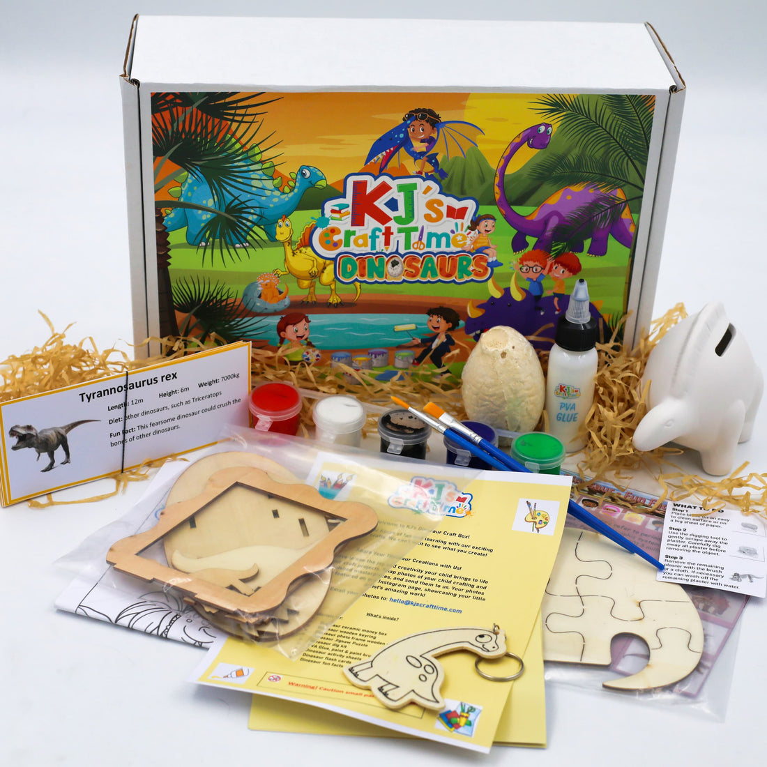 Dinosaur craft kit for kids by KJ’s Craft Time including wooden dinosaur crafts, paints, ceramic dinosaur coin bank and educational activity materials.
