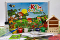 Close-up of materials included in the Nature craft kit for kids, including paint pots, paintbrushes, PVA glue and craft supplies.