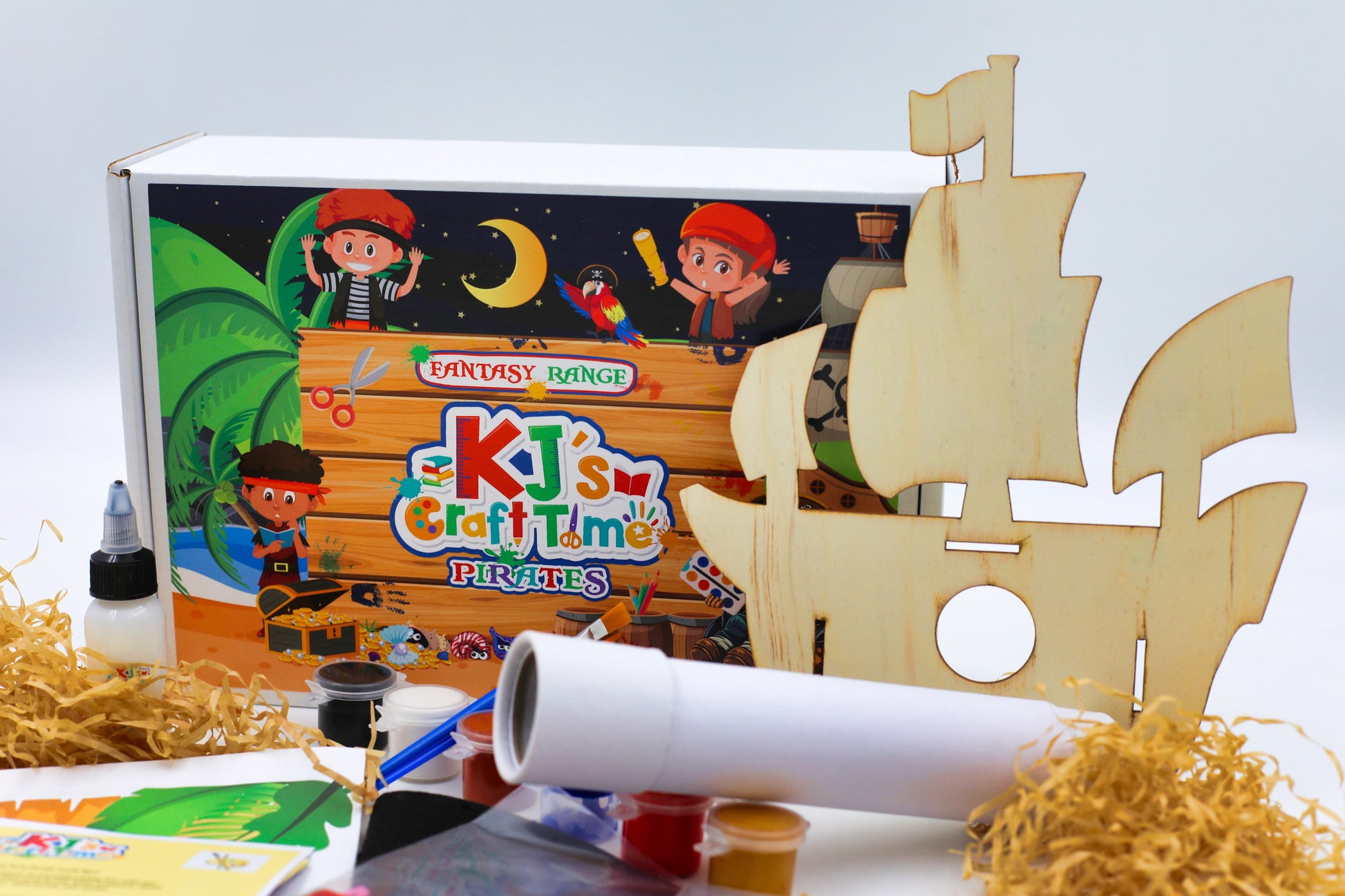Pirate craft kit for kids laid out with box and hands-on activities, perfect for creative play, birthdays and pirate-themed gifts.