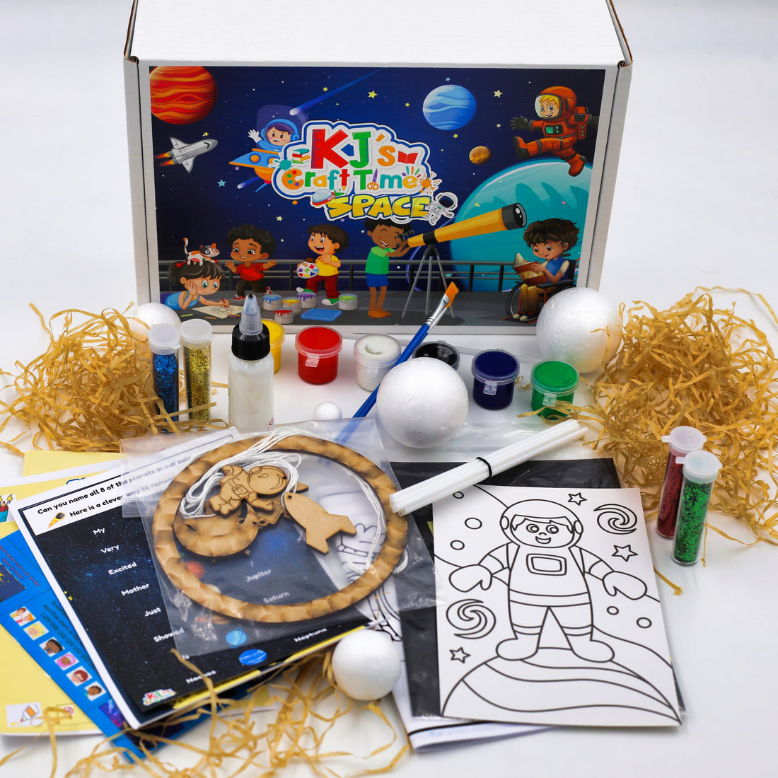 Space craft kit for kids by KJ’s Craft Time including wooden astronaut hanging craft, paint pots, polystyrene planets and educational activity sheets.