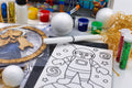 Close-up of materials included in the Space craft kit for kids including paint pots, polystyrene balls, colouring sheet and craft supplies.